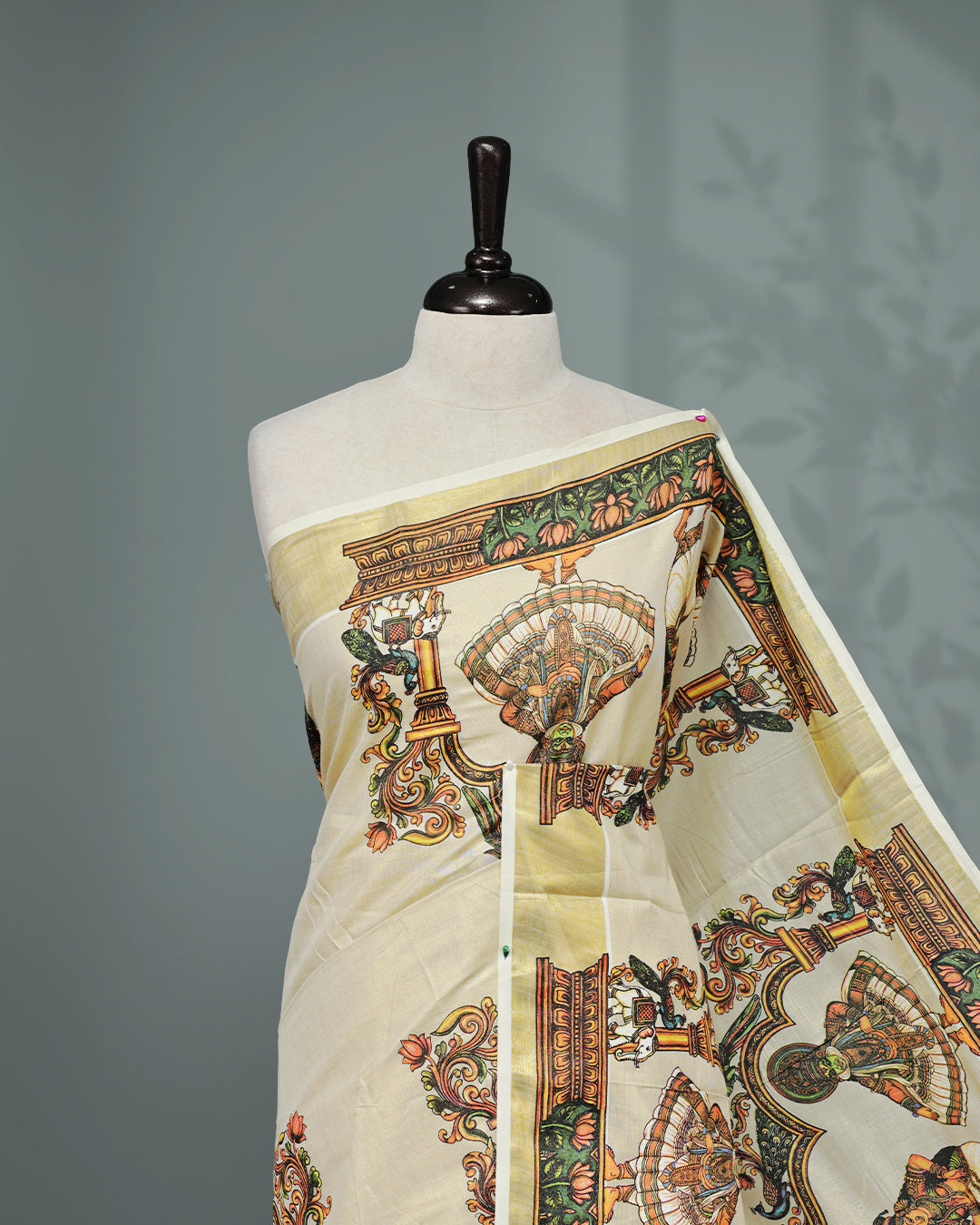 Cream colour Tissue Kerala saree Featuring An Elegant body, complemented by a classic gold zari with Indian Art form print on border, matching blouse piece.