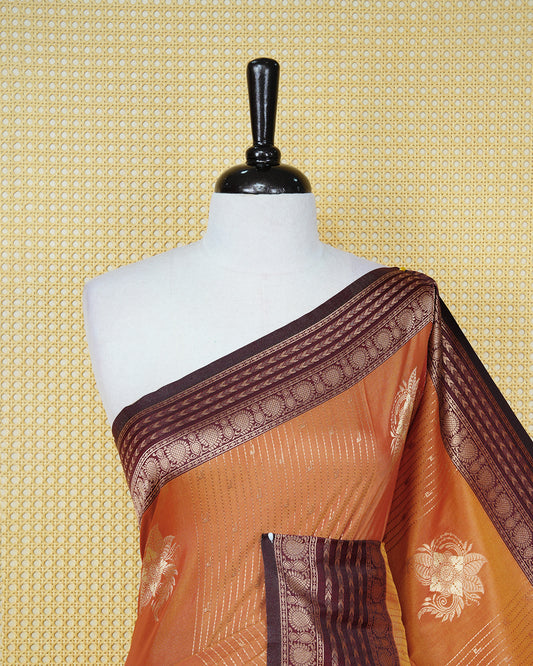 Rust orange & gold double shade Mulberry silk saree featuring floral gold zari patterns on body, paired with contrast maroon colour with traditional border, comes with matching blouse piece.