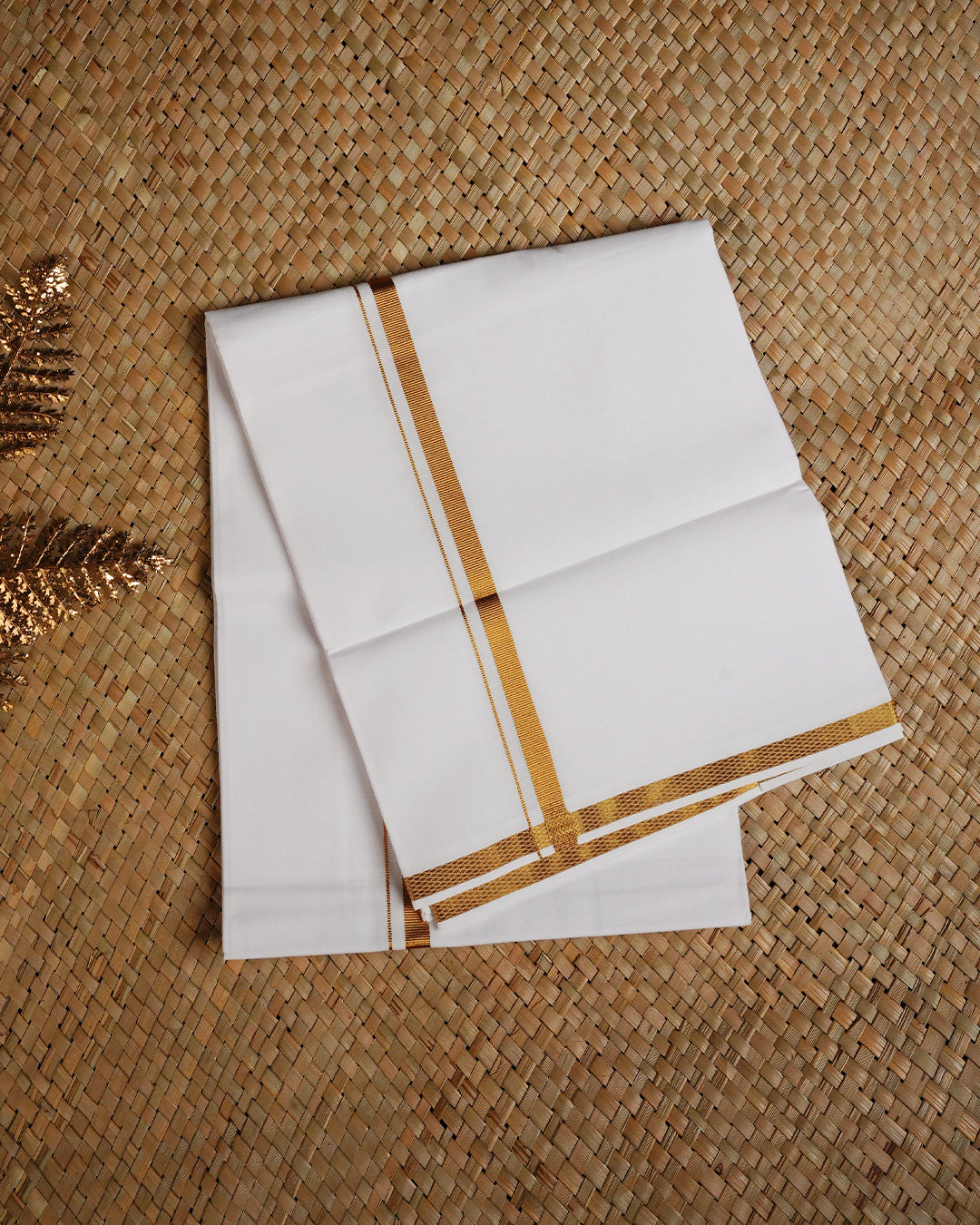 White colour cotton single dhoti featuring gold Kasav simple border.