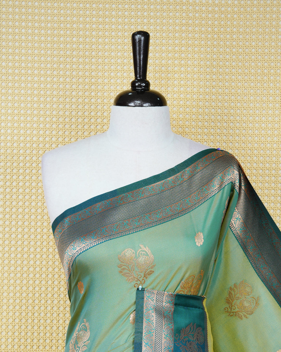 Olive green & gold double shade Mulberry silk saree featuring floral gold zari patterns on body, paired with contrast teal colour with traditional border, comes with matching blouse piece.