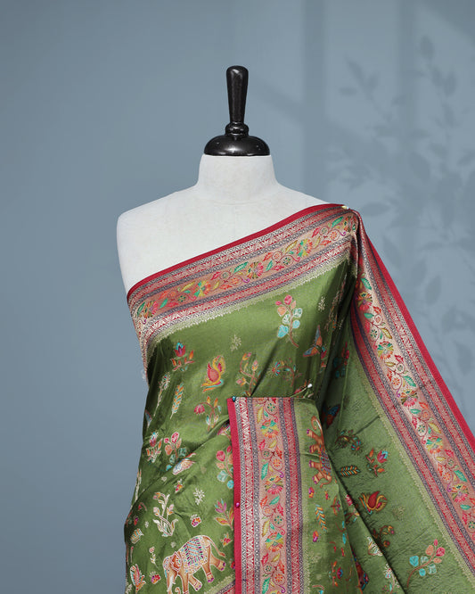 Olive  Colour Pashmina Saree featuring a Patterned body, complemented by Contrast Magenta colour with Floral pattern & gold zari on border and Pallu, comes with matching blouse piece.