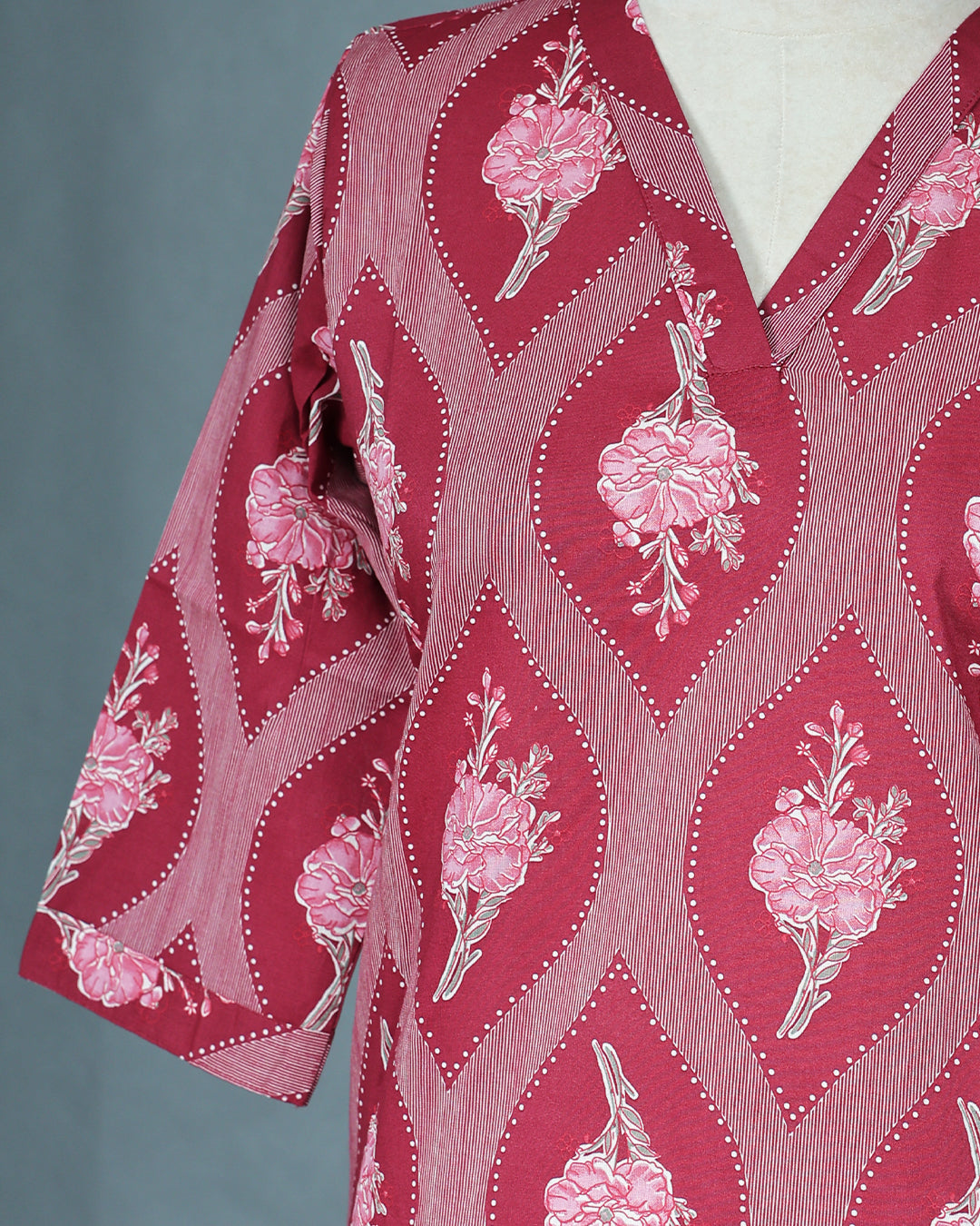 Maroon Colour Kurti featuring print Work On body , a V neckline, With sleeve.