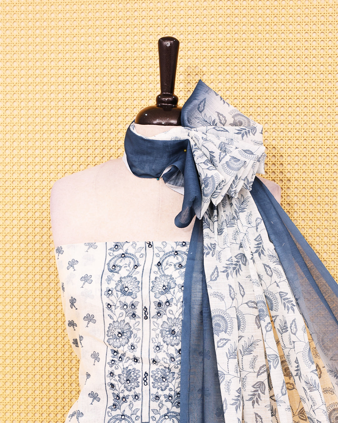 Off White colour Linen salwar material featuring Print & mirror work on body, paired with Contrast Greyish Blue colour bottom & dupatta.