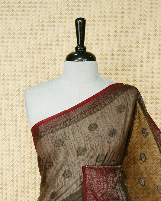 Light chocolate colour semi linen saree thread motifs on body, contrast light red colour gold zari border, rich pallu comes with matching blouse piece