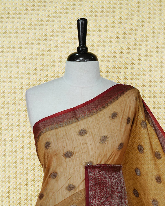 Sandal colour semi linen saree thread motifs on body, contrast maroon colour gold zari border, rich pallu comes with matching blouse piece