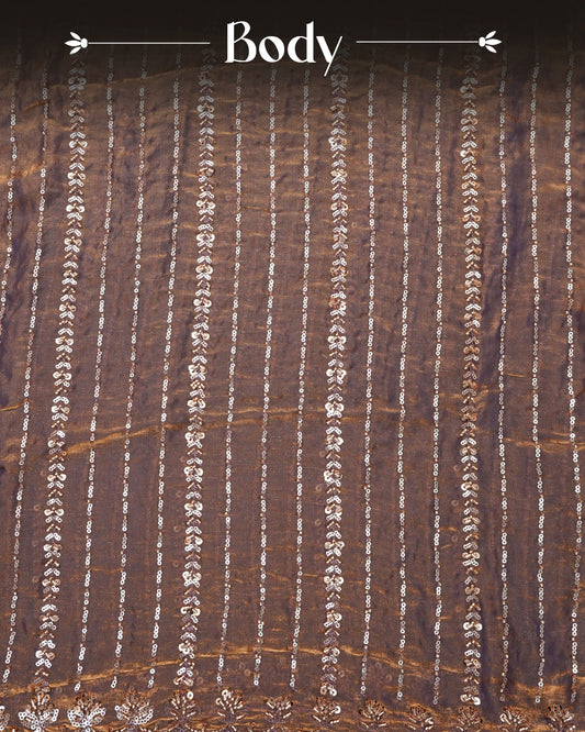 Brown colour Velvet chiffon designer saree featuring Sequins & cut beats strips on body and scallop border, comes with matching blouse piece.