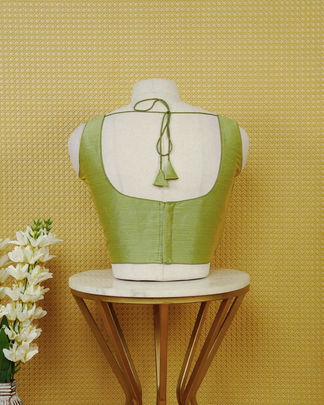 Pastel green colour Sleeveless Blouse Featuring A Classic Scoop Neck, Smooth Finish, And A Comfortable Tailored Fit.