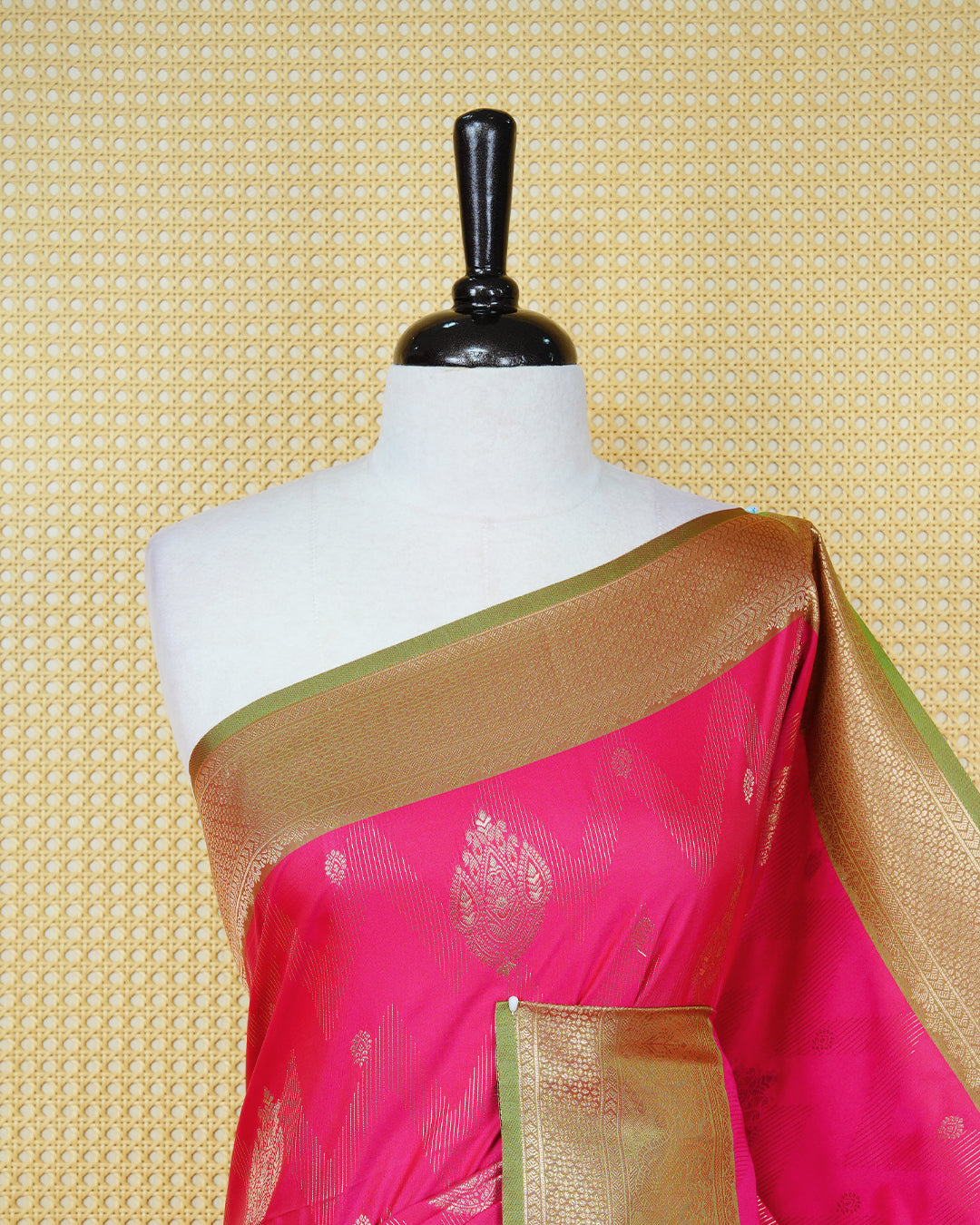 Pink Mulberry silk saree featuring gold floral zari patterns on body, paired with contrast light green colour with traditional border, comes with matching blouse piece.