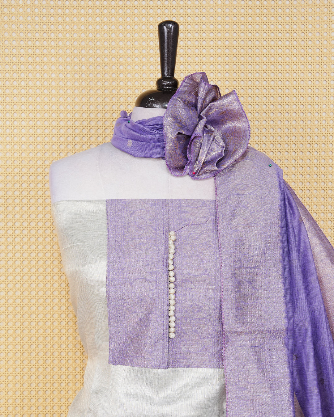Cream colour Tissue salwar material featuring Plain Body Design without border, lavender colour work on neck portion, paired with matching bottom and elegant dupatta.