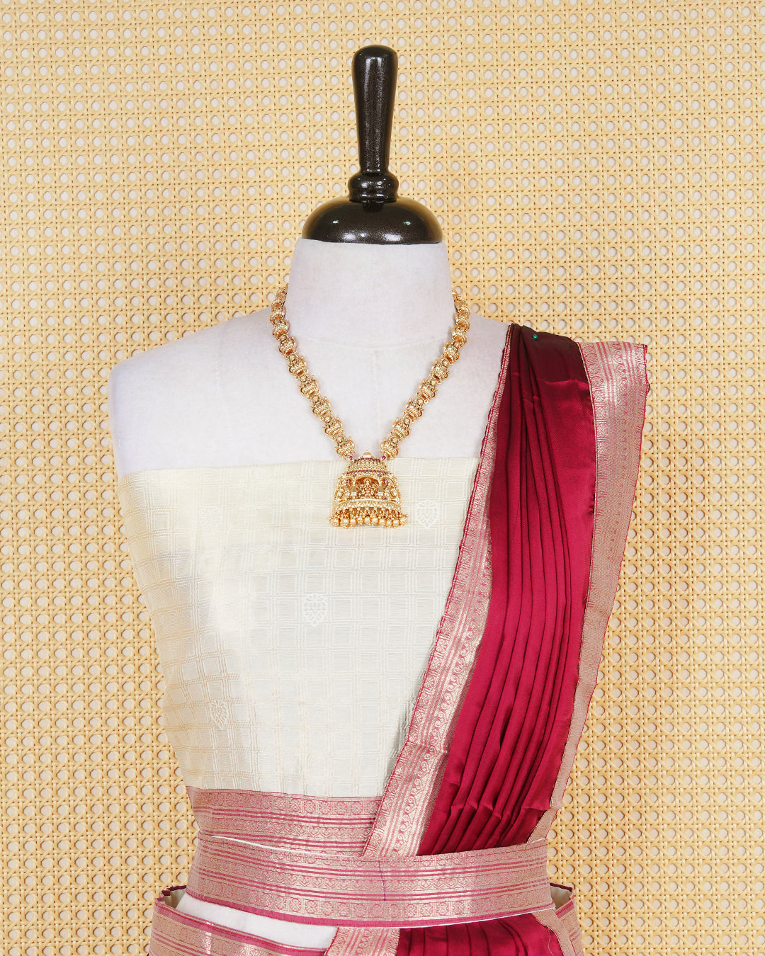 Cream colour  tissue Semi stitched dhavani set featuring Gold zari check pattern with motifs on body ,contrast Brick Red colour with gold zari bordered skirt, paired with matching blouse piece & dupatta.