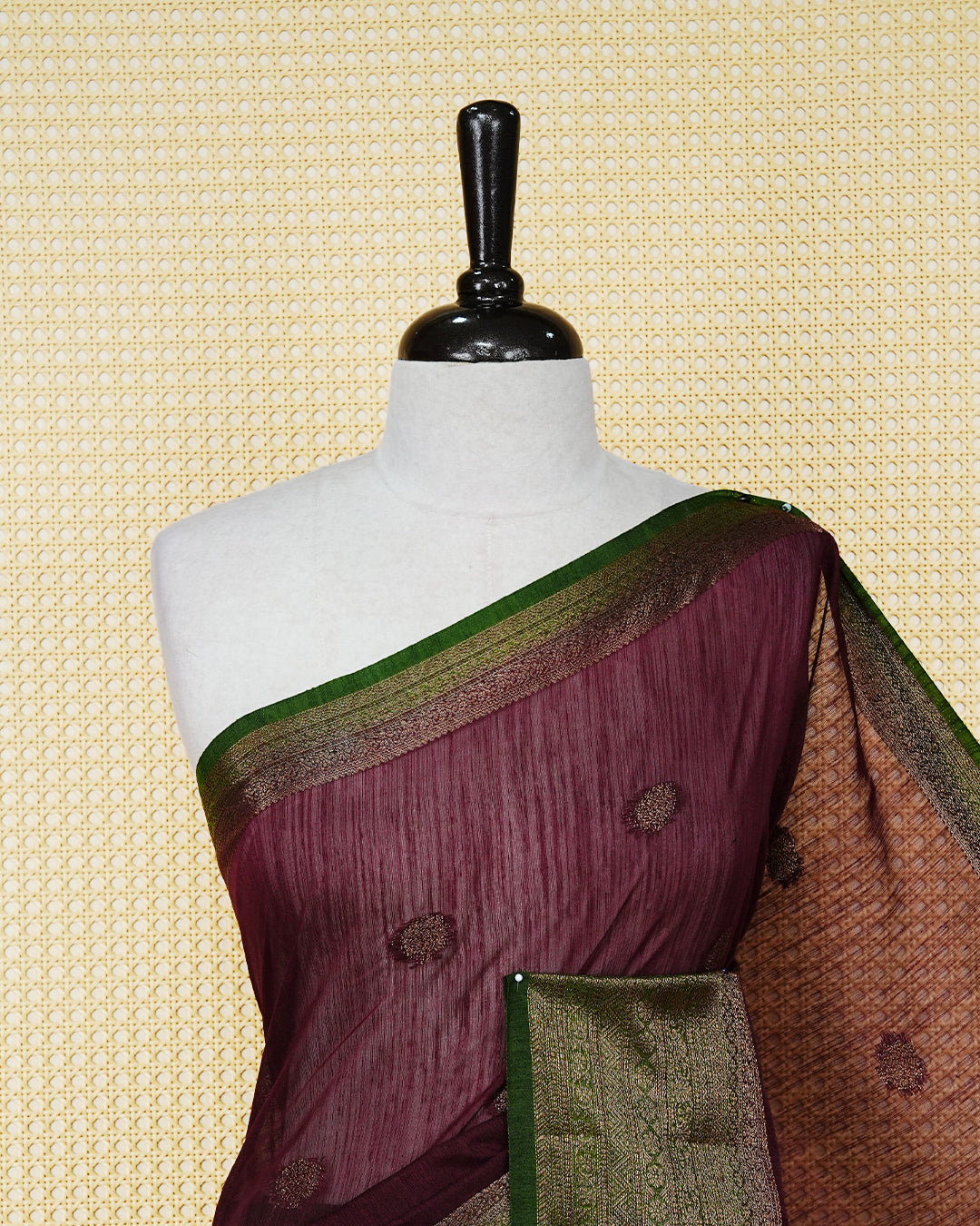 Wine colour semi linen saree thread motifs on body, contrast mehndi green colour gold zari border, rich pallu comes with matching blouse piece