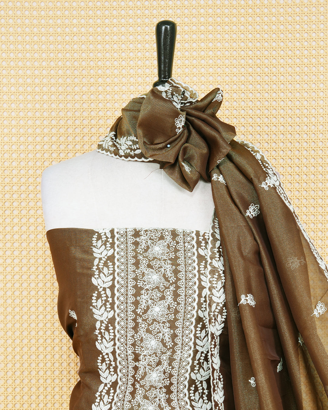 Brown Georgette Salwar Material Features an Inrcate Floral Emproidary Pattern Aborned With Shimmering Sequin Accents, paired with matching bottom & elegant Duptta