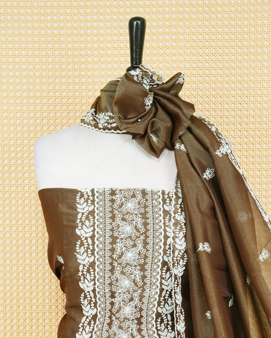 Brown Georgette Salwar Material Features an Inrcate Floral Emproidary Pattern Aborned With Shimmering Sequin Accents, paired with matching bottom & elegant Duptta