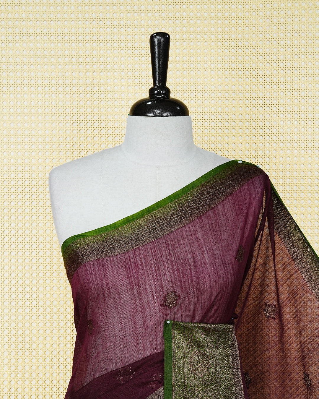Wine colour semi linen saree thread motifs on body, contrast mehndi green colour gold zari border, rich pallu comes with matching blouse piece