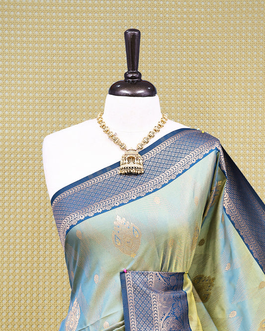 Olive green & gold double shade Mulberry silk saree featuring floral gold zari patterns on body, paired with contrast teal colour with traditional border, comes with matching blouse piece.