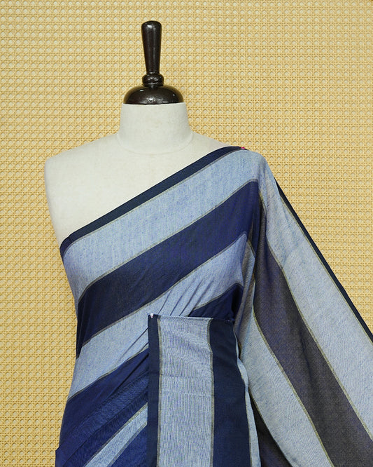 Navy Blue & Light Blue colour Mul cotton saree featuring Gold zari strips, complemented by self colour simple Border & tassels.