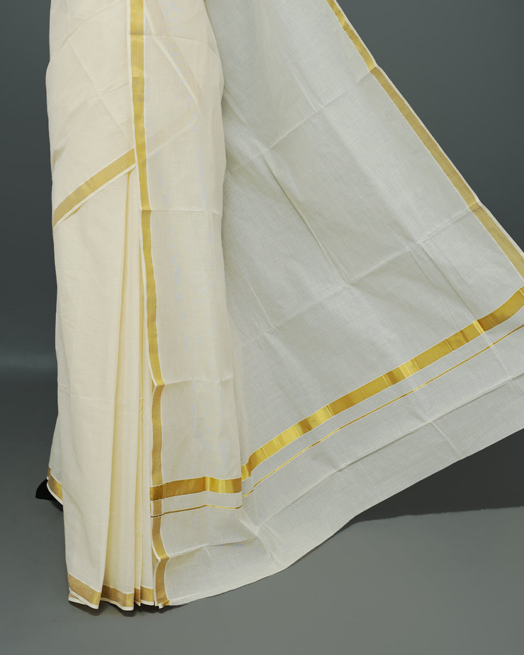 Cream colour Kerala saree Featuring an Elegant plain body, complemented by a classic simple gold zari border, matching blouse piece.