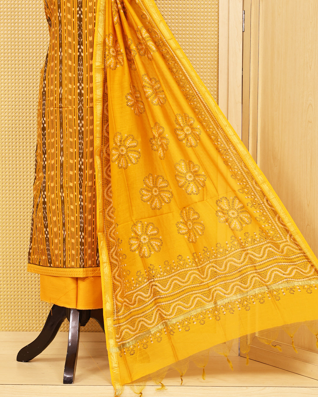 Mustard Yellow colour Cotton Salwar Material featuring elegant ikat inspired vertical stripes on the kurta, paired with a matching solid bottom and a beautifully printed dupatta