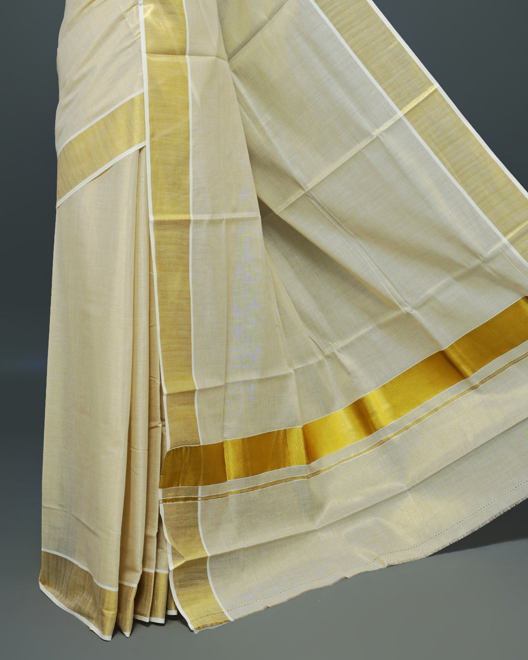 Cream colour Tissue Kerala saree Featuring An Elegant plain body, complemented by a classic gold zari border, matching blouse piece.