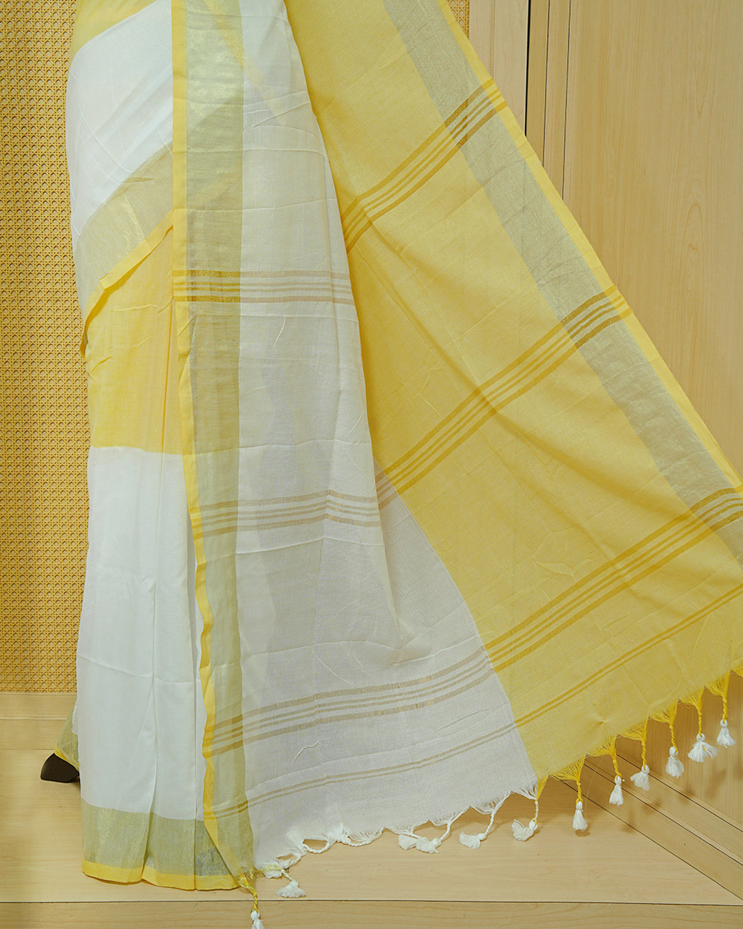 Yellow & White Colour Half & Half Mul cotton saree Complemented by contrast colour Gold Zari Border & tassels.
