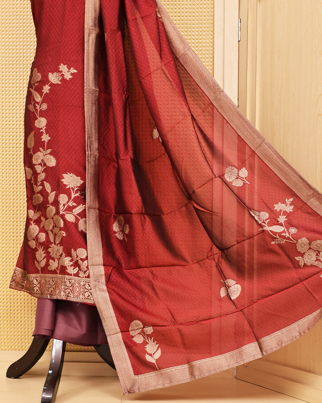 Red colour Banaras salwar material featuring Zari floral work on body, paired with Matching bottom & dupatta.