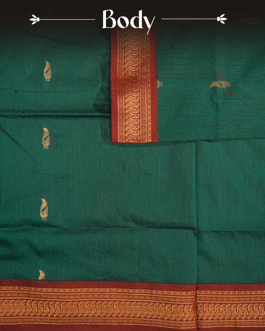 Peacock Green Colour Kalyani cotton saree featuring elegant antique zari peacock butta motifs on the body, complemented by a Maroon contrast pallu with a rich antique zari border, paired with a matching blouse piece