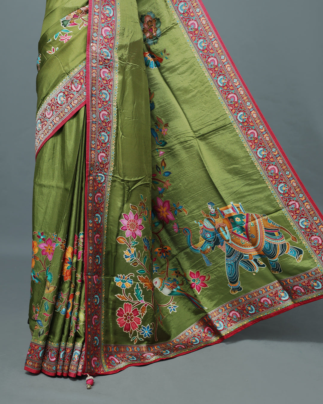 Olive Colour Pashmina Saree featuring Plain body, complemented by Contrast Magenta colour with Floral pattern & gold zari on border and Pallu, comes with matching blouse piece.