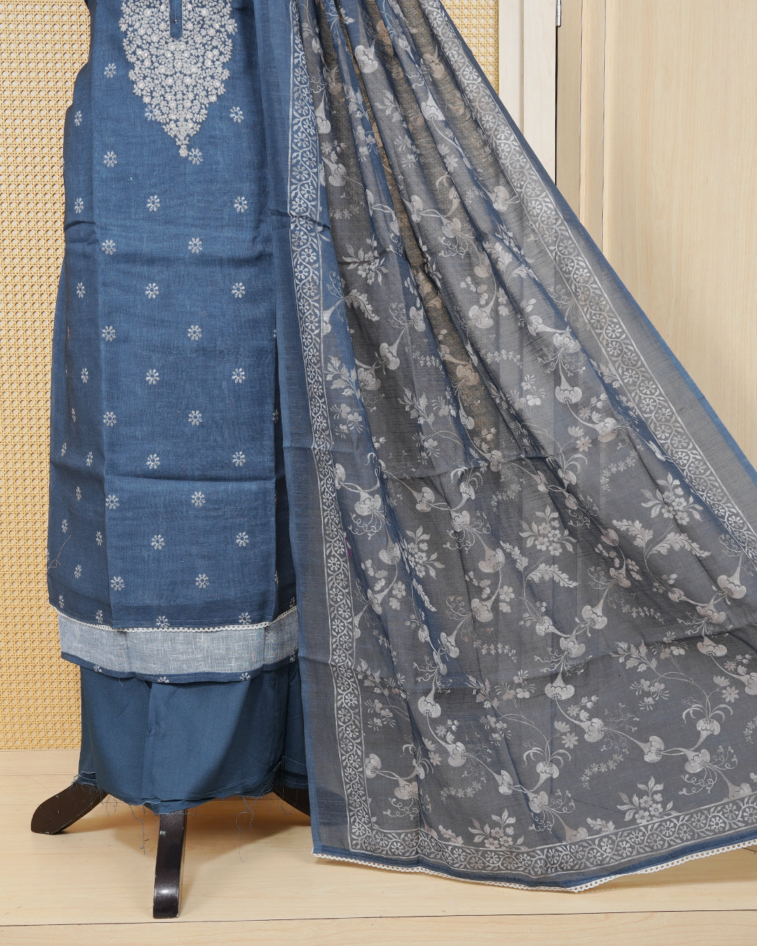 Dusty Blue colour Net kota salwar material featuring elegant Threadwork on neck portion & floral prints on body, paired with a matching bottom and an elegant dupatta.