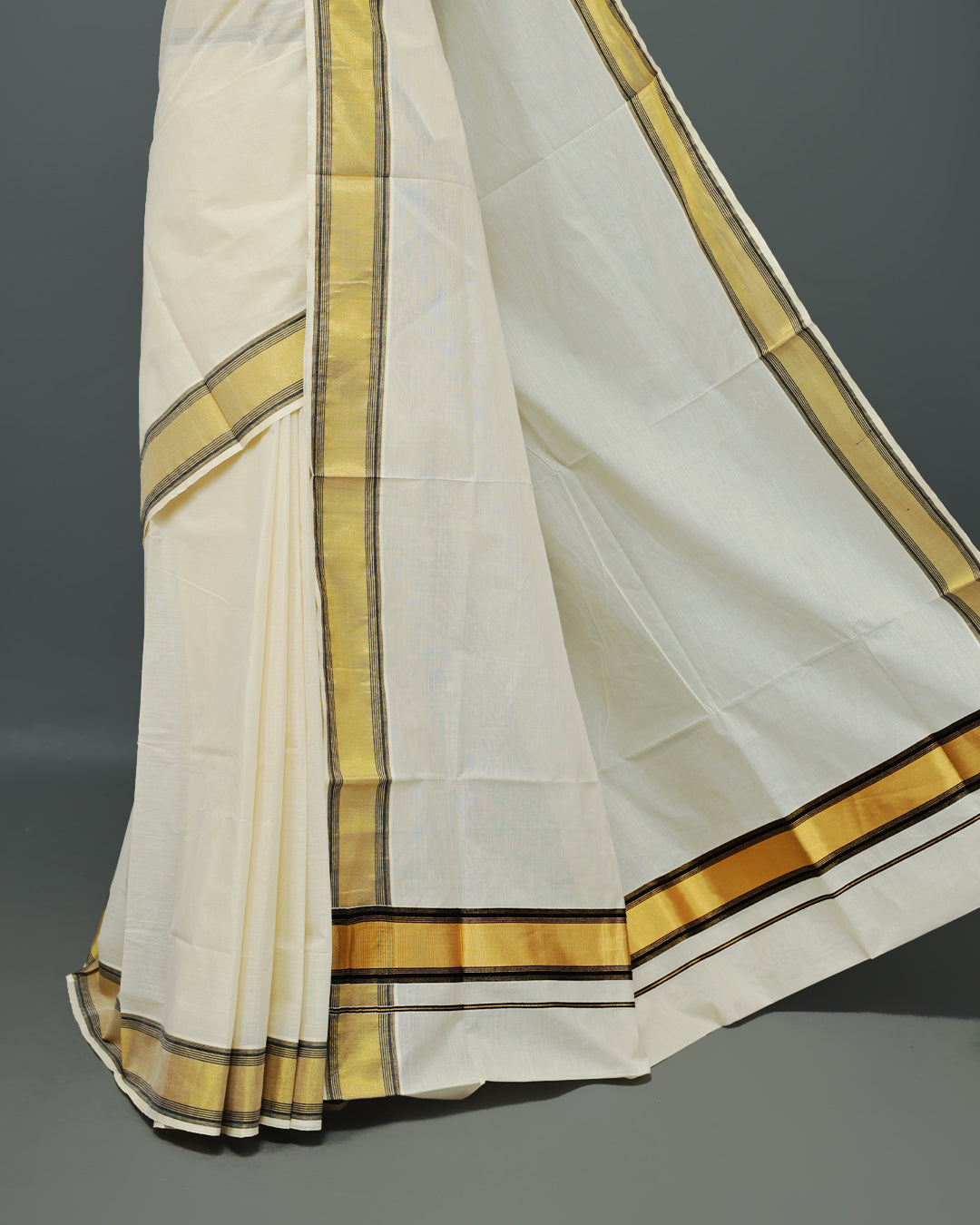 Cream colour Kerala saree Featuring an Elegant plain body, complemented by a classic gold & black zari border, matching blouse piece.