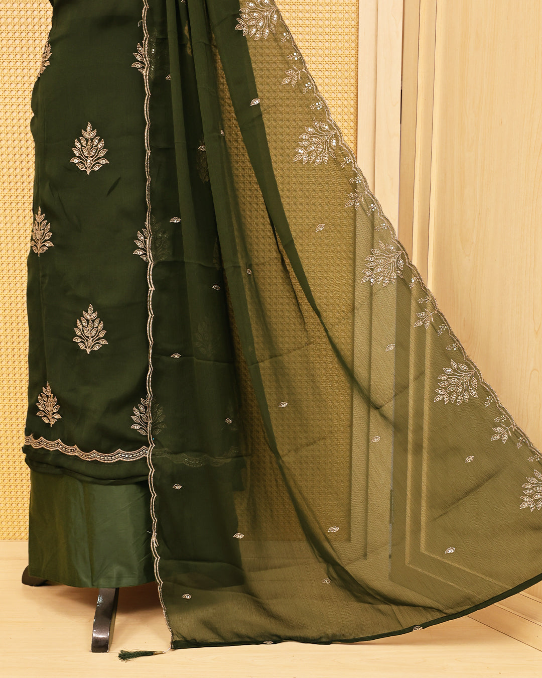 Olive Green colour salwar material featuring Thread with Sequin work on body, paired with matching bottom & dupatta.