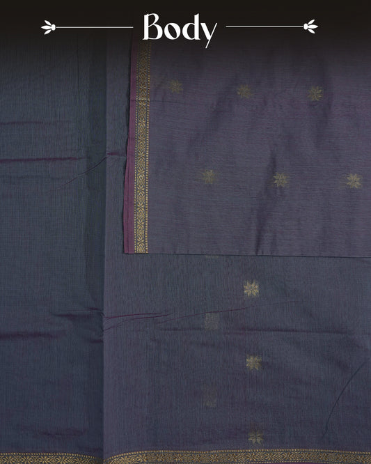 Bluish Grey Colour Kalyani Cotton Saree Featuring Gold Zari Floral Patterns on the Body, Complemented by a Dark Wine Colour Border with Stripes & Floral Gold Zari, Paired with a Matching Blouse Piece.