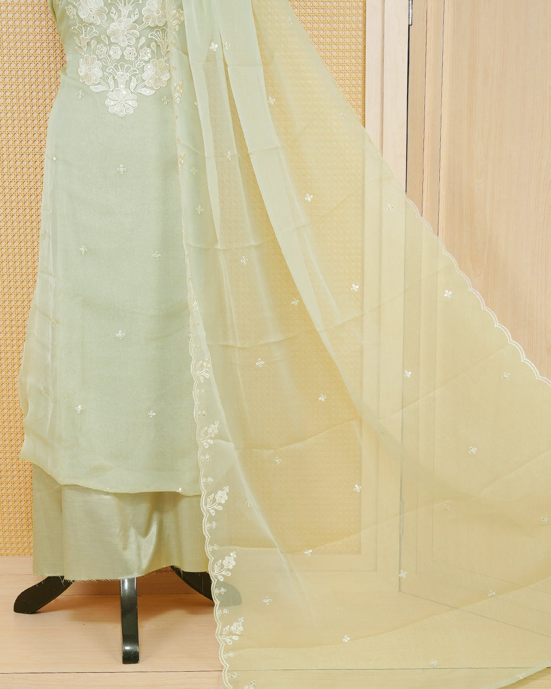 Pastal Green Georgette Salwar Material Features an Inrcate Floral Emproidary Pattern Aborned With Shimmering Sequin Accents, paired with matching bottom & elegant Duptta