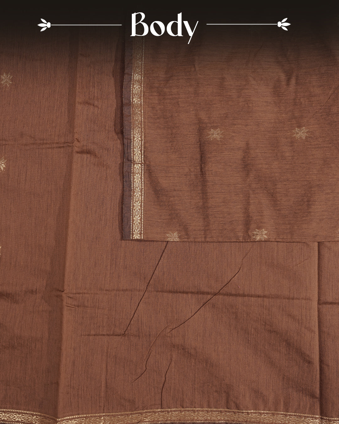 Brown colour Kalyani cotton saree featuring a gold zari floral pattern on the body, complemented by a magenta pallu with gold zari stripes and a floral zari border, paired with a matching blouse piece