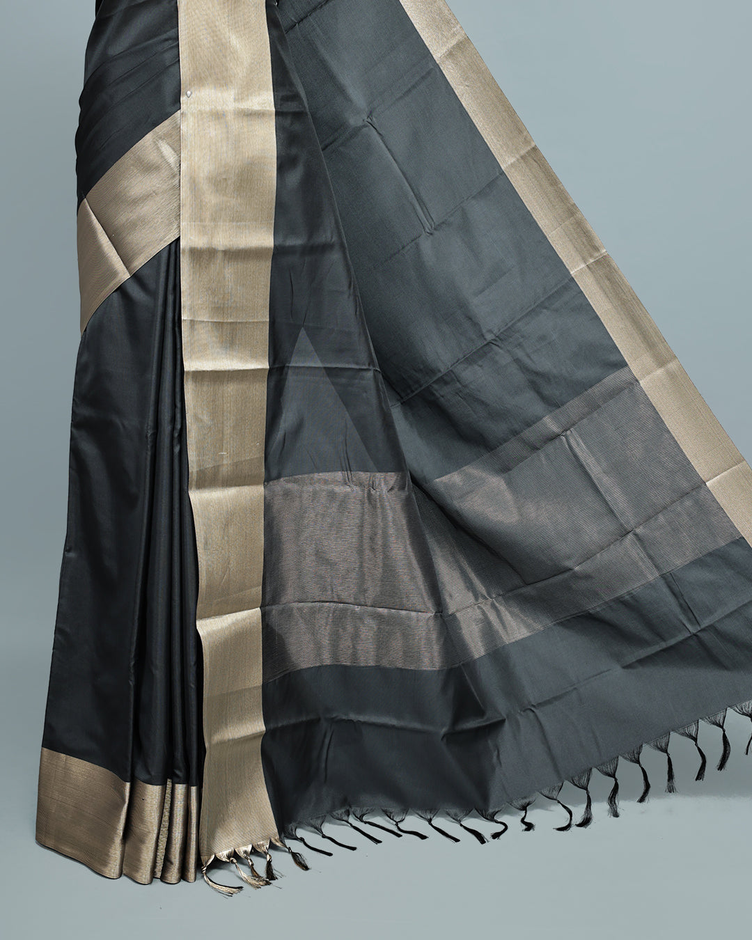 Black colour saree featuring a plain body, complemented by a Bavanchi border and contrast pallu, paired with a matching blouse piece.