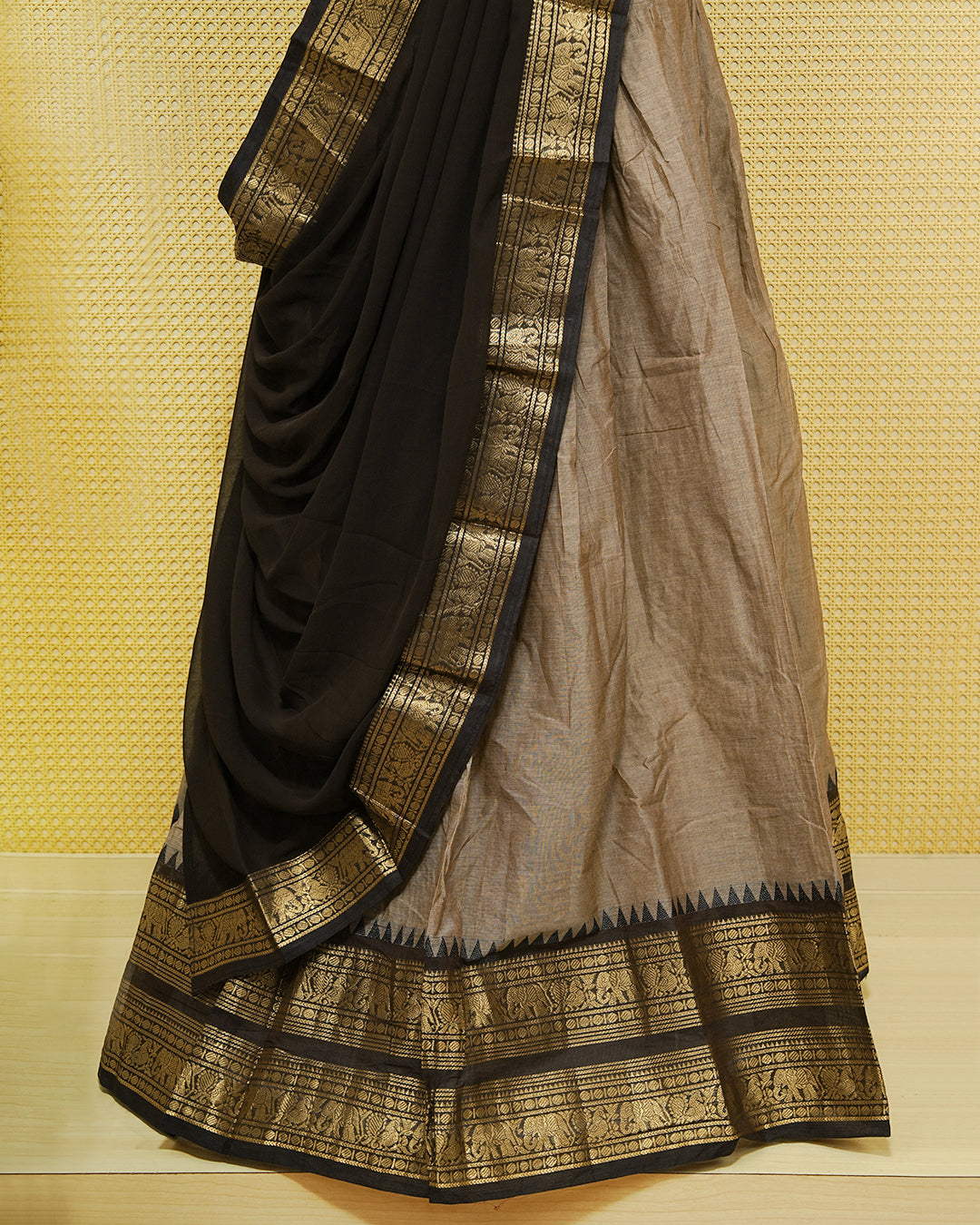 Grey colour Chettinad Semi Stitched dhavani set Featuring contrast Dark chocolate with Gold zari border on skirt, Contrast Blouse & matching dupatta.