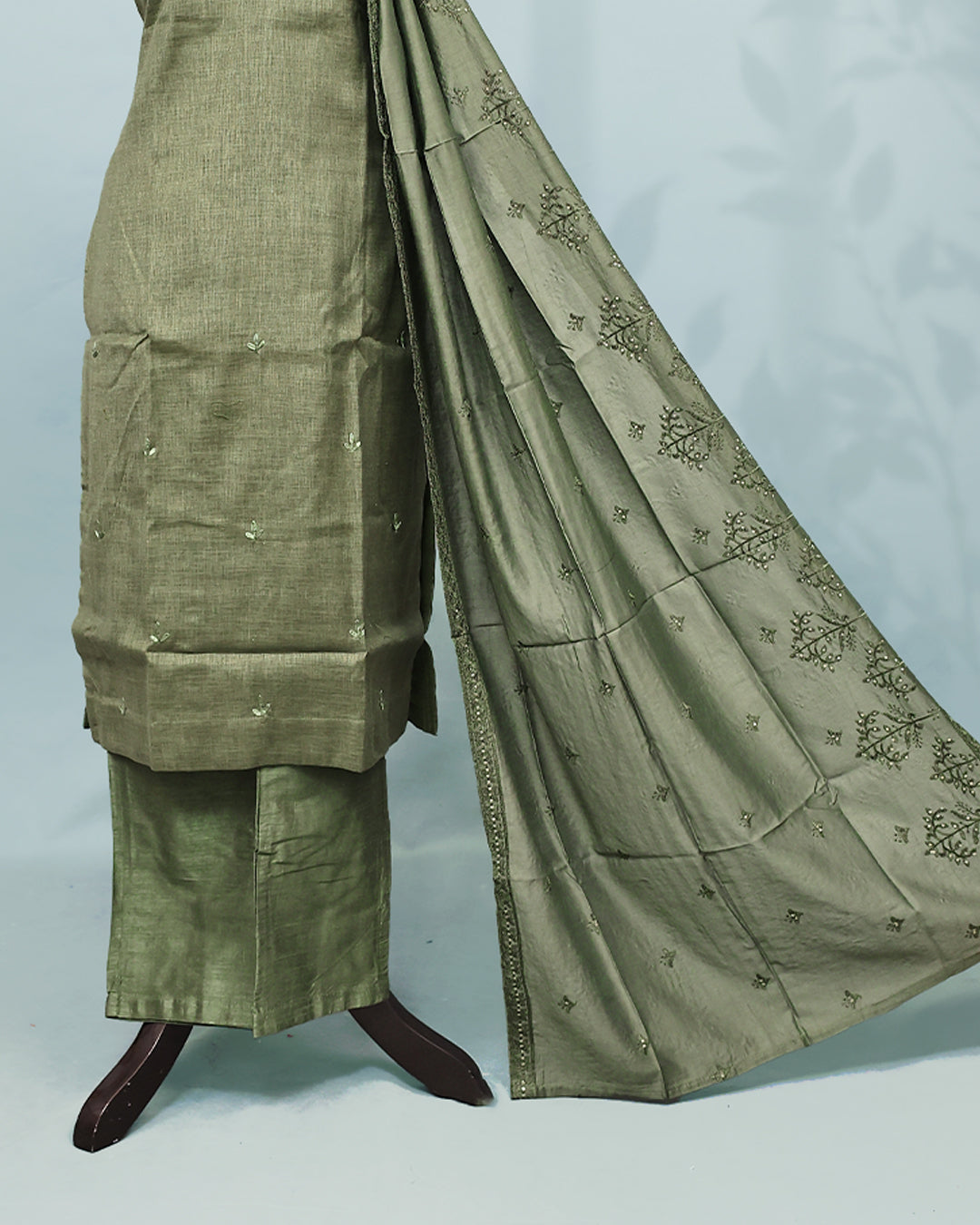 Olive green colour Salwar set comes top with Thread & beats on neck line, paired with matching bottom and dupatta.