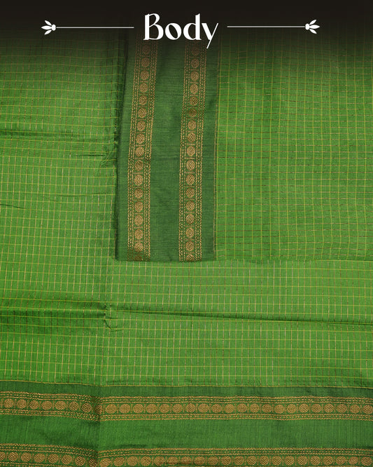 Green colour kalyani cotton saree featuring zari check pattern on body, complemented by Contrast colour with Antique zari border, paired with matching blouse piece