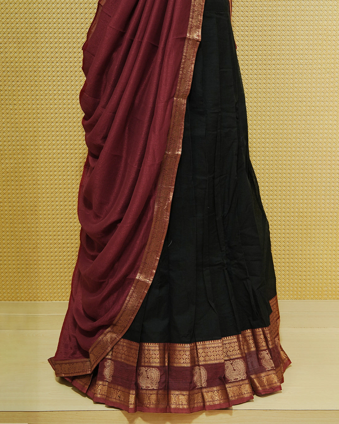 Black Colour chettinad cotton Semi stitched dhavani set featuring Contrast Maroon with Gold zari border skirt, comes with Matching blouse piece & dupatta.