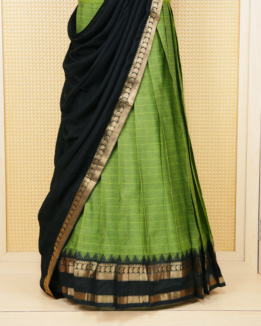 Leaf green colour Chettinad Semi Stitched dhavani set Featuring black with Gold zari on skirt, matching Blouse & Contrast dupatta.