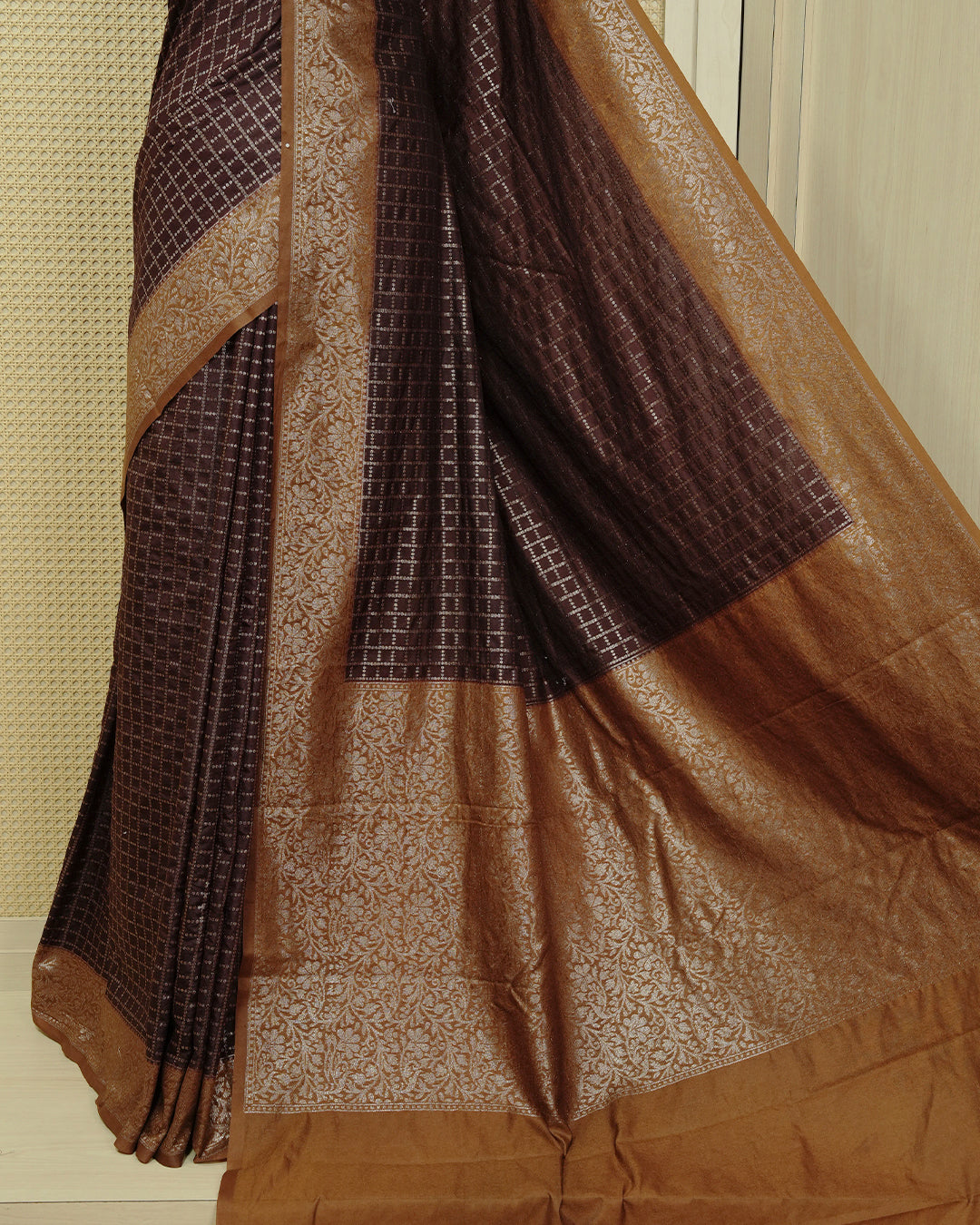 Dark coffee brown Colour Semi georgette Saree having zari dotted check pattern on body, contrast dark mustard colour floral kodi designed Border, Rich Pallu comes with Matching Blouse piece.