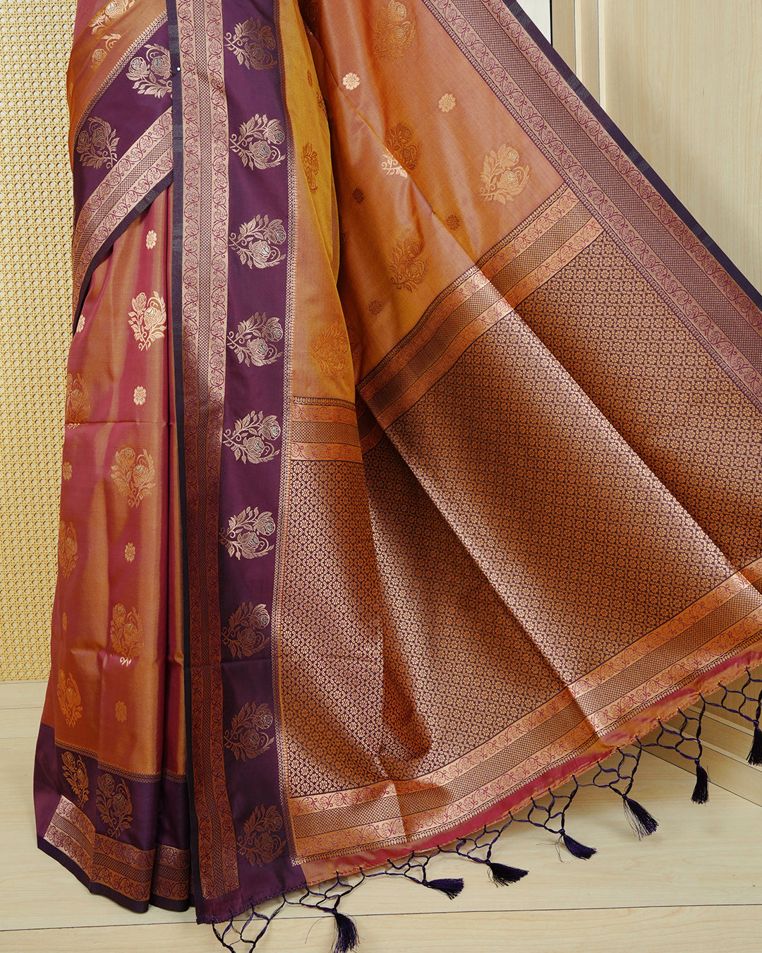 Rust orange & gold double shade Mulberry silk saree featuring gold floral zari patterns on body , paired with contrast magenta colour with traditional border, comes with matching blouse piece.