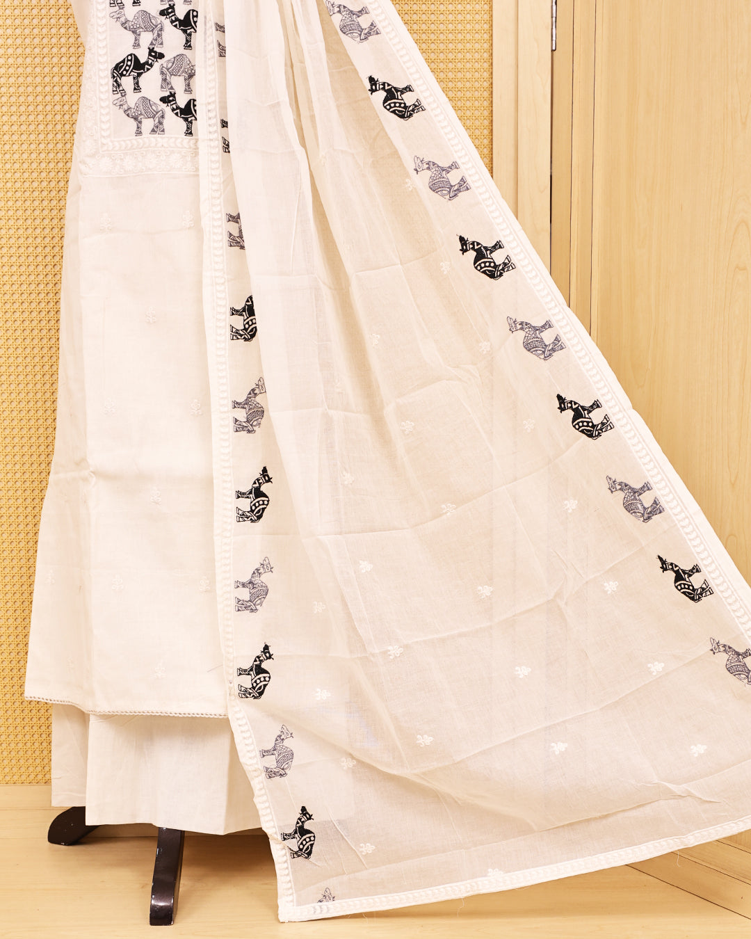 Off White colour Cotton salwar material featuring Thread Camel work on body, paired with matching bottom & dupatta.