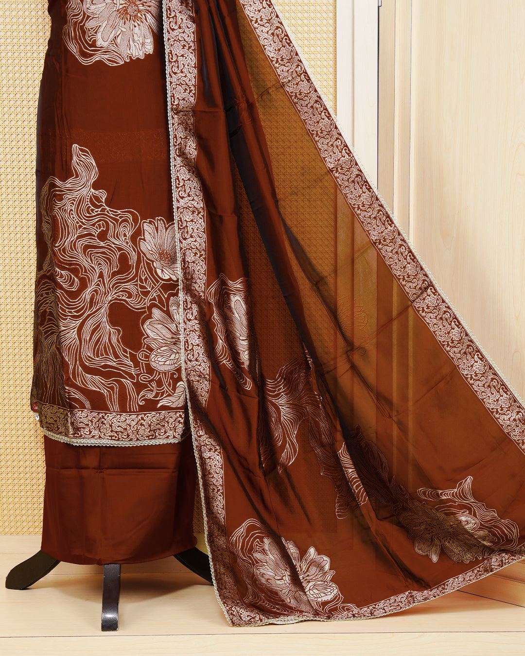 Maroon Silk Salwar Matierial Featuers an Anstract Wavy Line Embroidary Pattern Aborned With Shimmering Metalic Gold Thread, pired with matching bottom & elegant Duptta