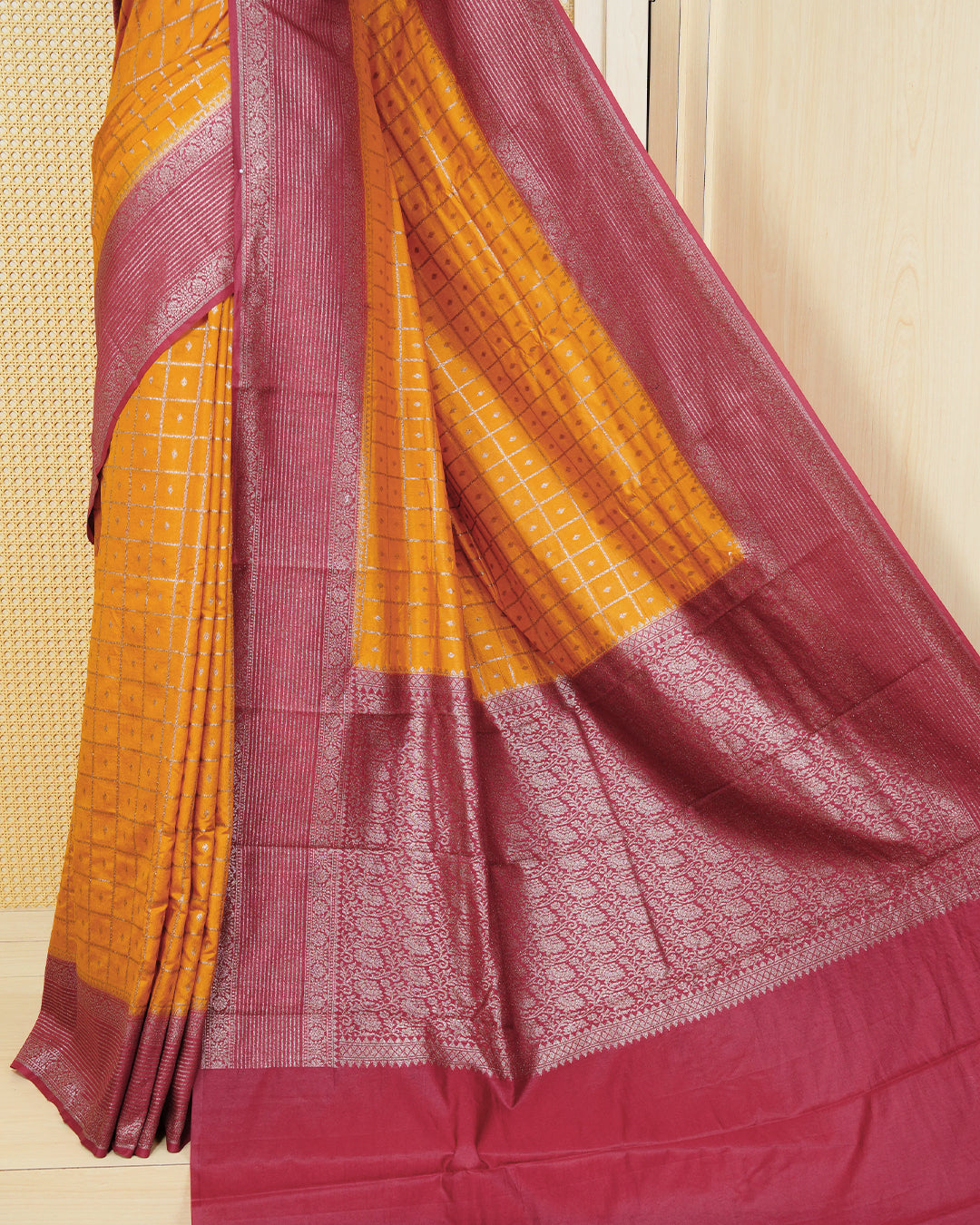 Mustard yellow Colour Semi georgette Saree having zari check with buttas pattern on body, contrast maroon colour floral designed border, Rich Pallu comes with Matching Blouse piece.