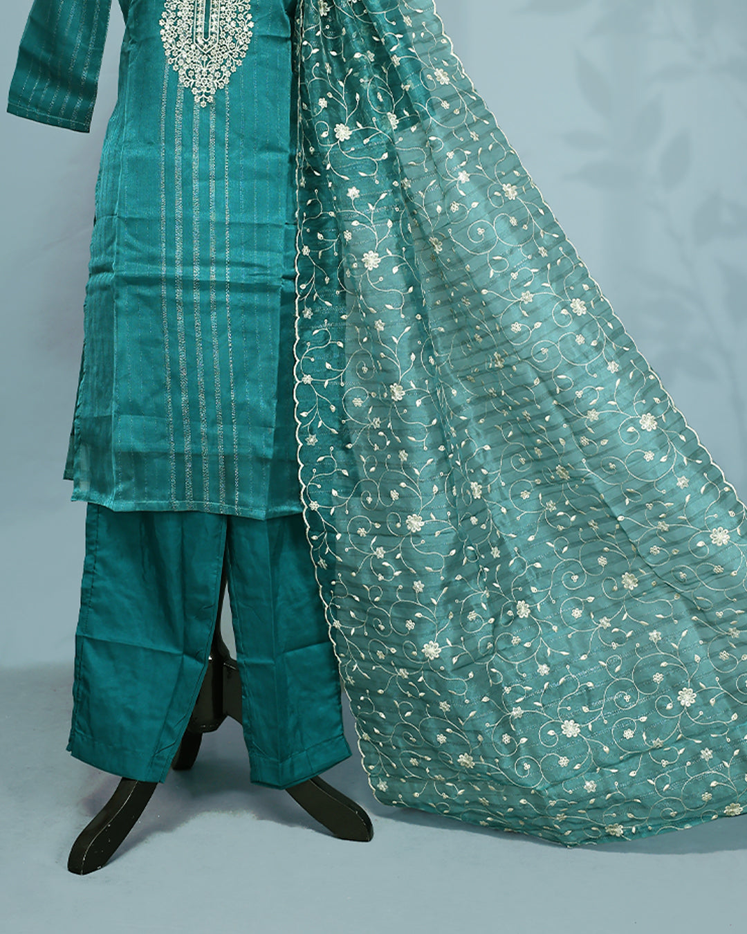 Peacock Green colour salwar set with Sequins & thread work on top, paired with matching bottom & Dupatta.