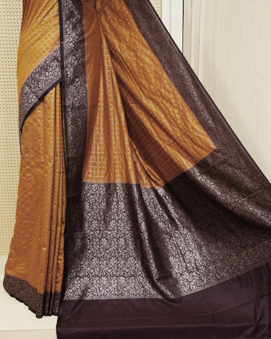 Mustard yellow Colour Semi georgette Saree having zari dotted check pattern on body, contrast dark coffee browncolour floral kodi designed Border, Rich Pallu comes with Matching Blouse piece.