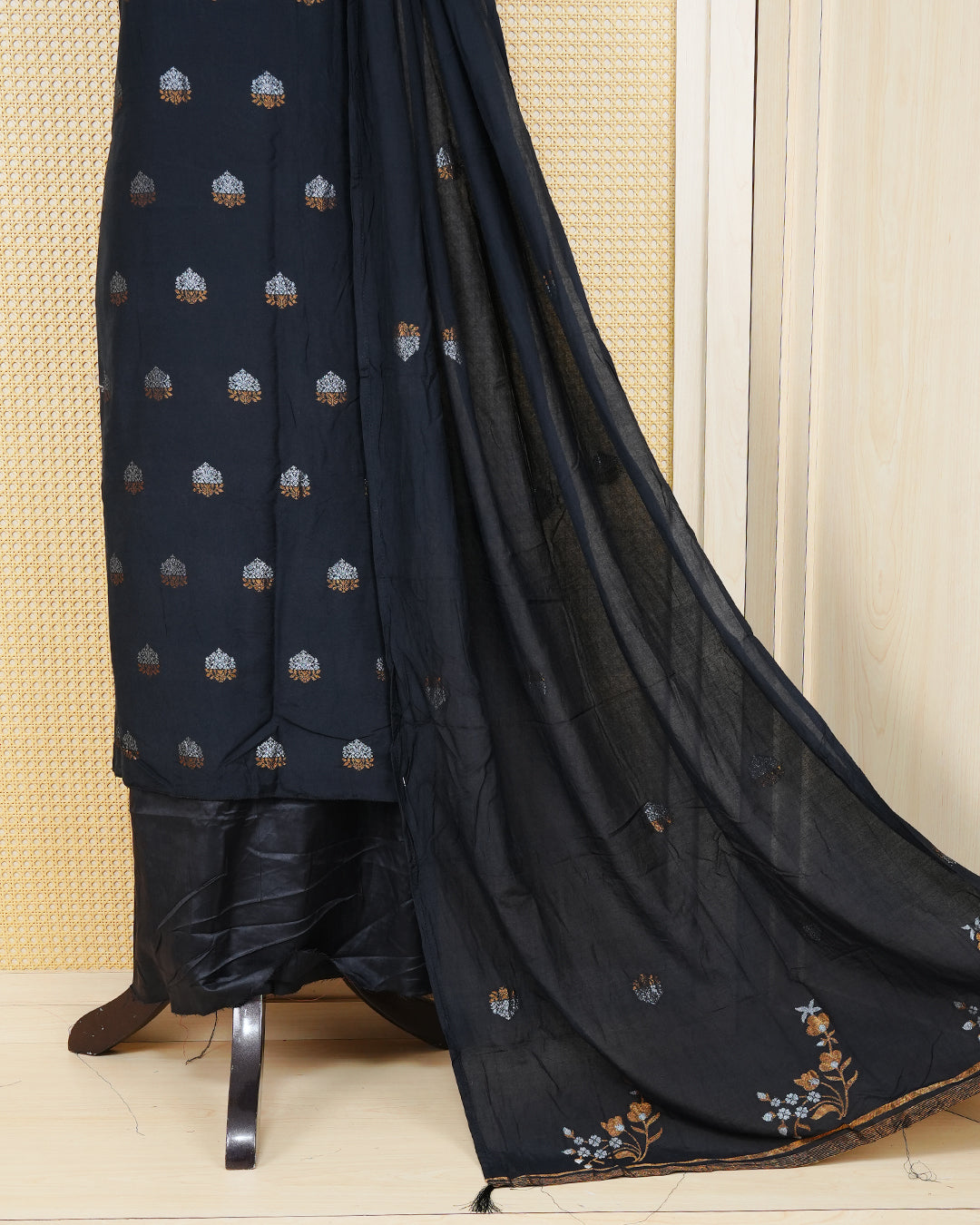 Black colour Georgette Salwar material Featuring Gold & silvar zari floral motifs on body, paired with matching bottom & Elegant Dupatta