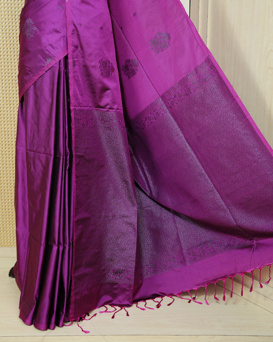 Dark magenta colour soft silk saree featuring antique zari motifs on body with contrast self colour pallu & paired with matching blouse piece.