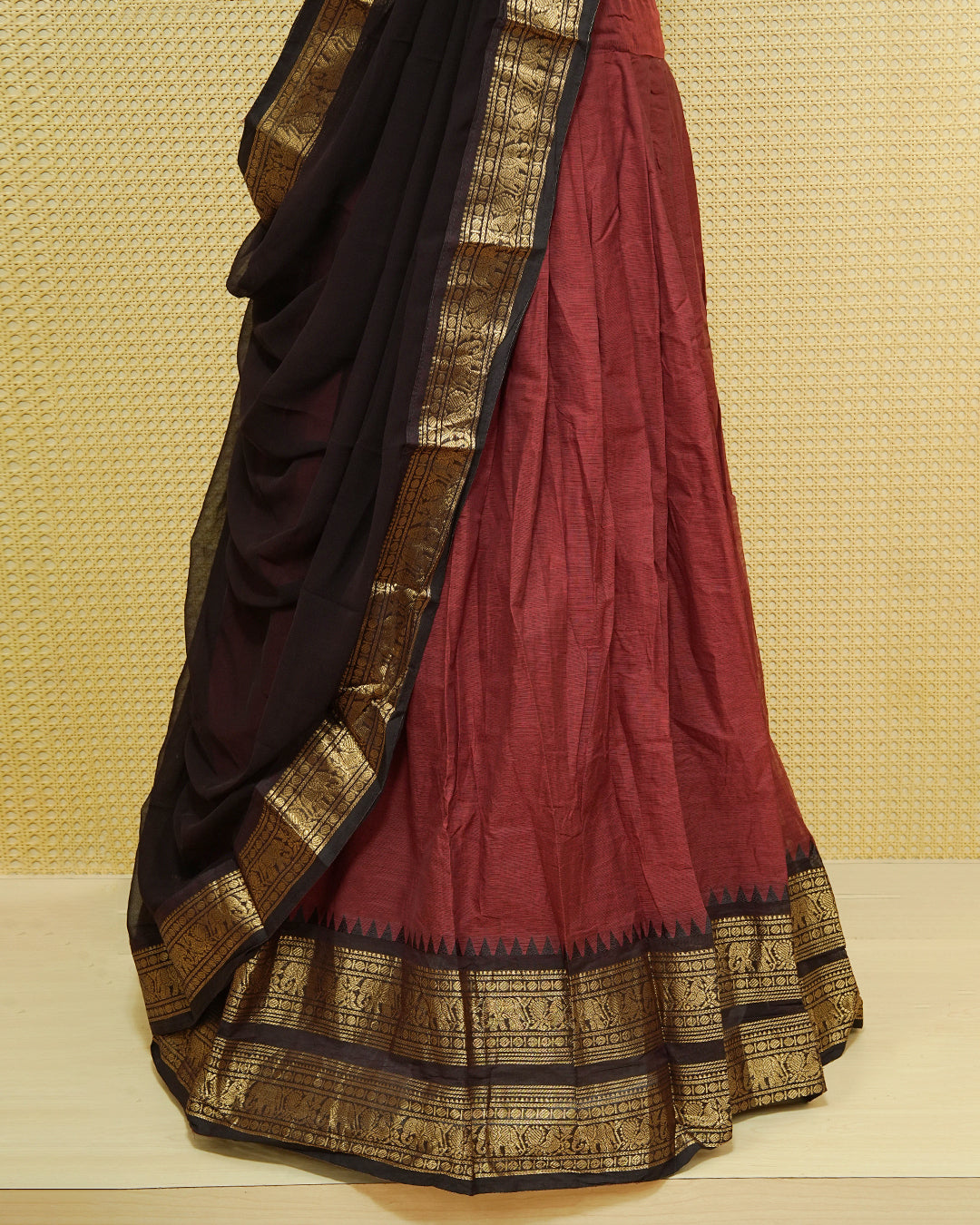 Maroon colour Chettinad Semi Stitched dhavani set Featuring contrast Black with Gold zari border on skirt, Contrast Blouse & matching dupatta.