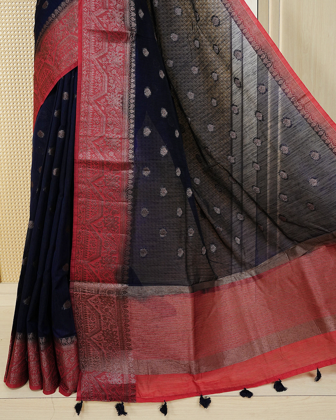 Navy blue colour semi linen saree thread motifs on body, contrast red colour gold zari border, rich pallu comes with matching blouse piece